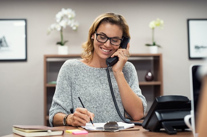 happy mature woman talking on phone
